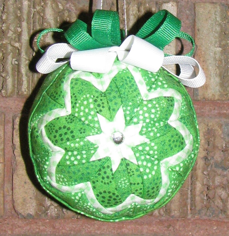 A lovely, green, handcrafted folded star Christmas ornament