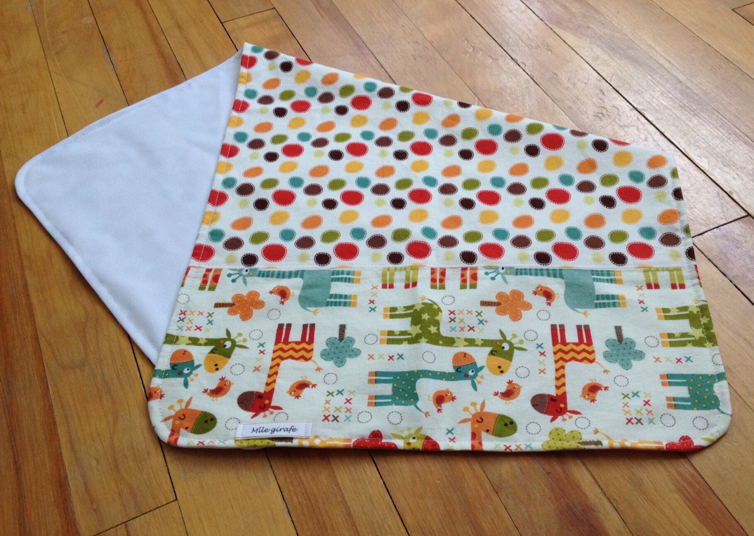 Travel changing pad waterproof in PUL with a giraffe pattern