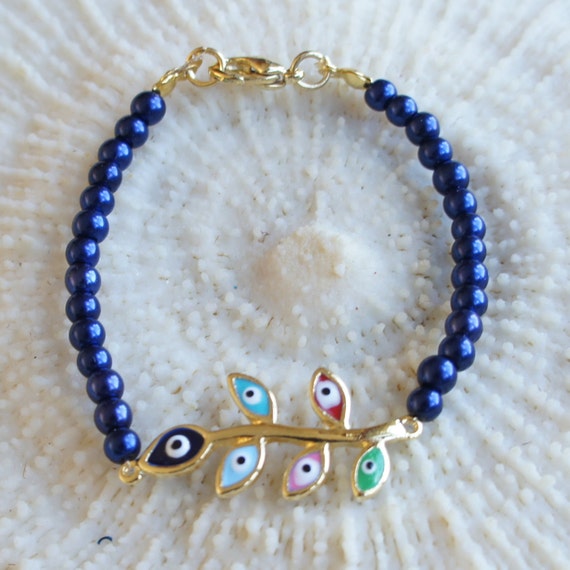Items similar to Evil Eye Bracelet, Metallic Navy Blue Bracelet ...