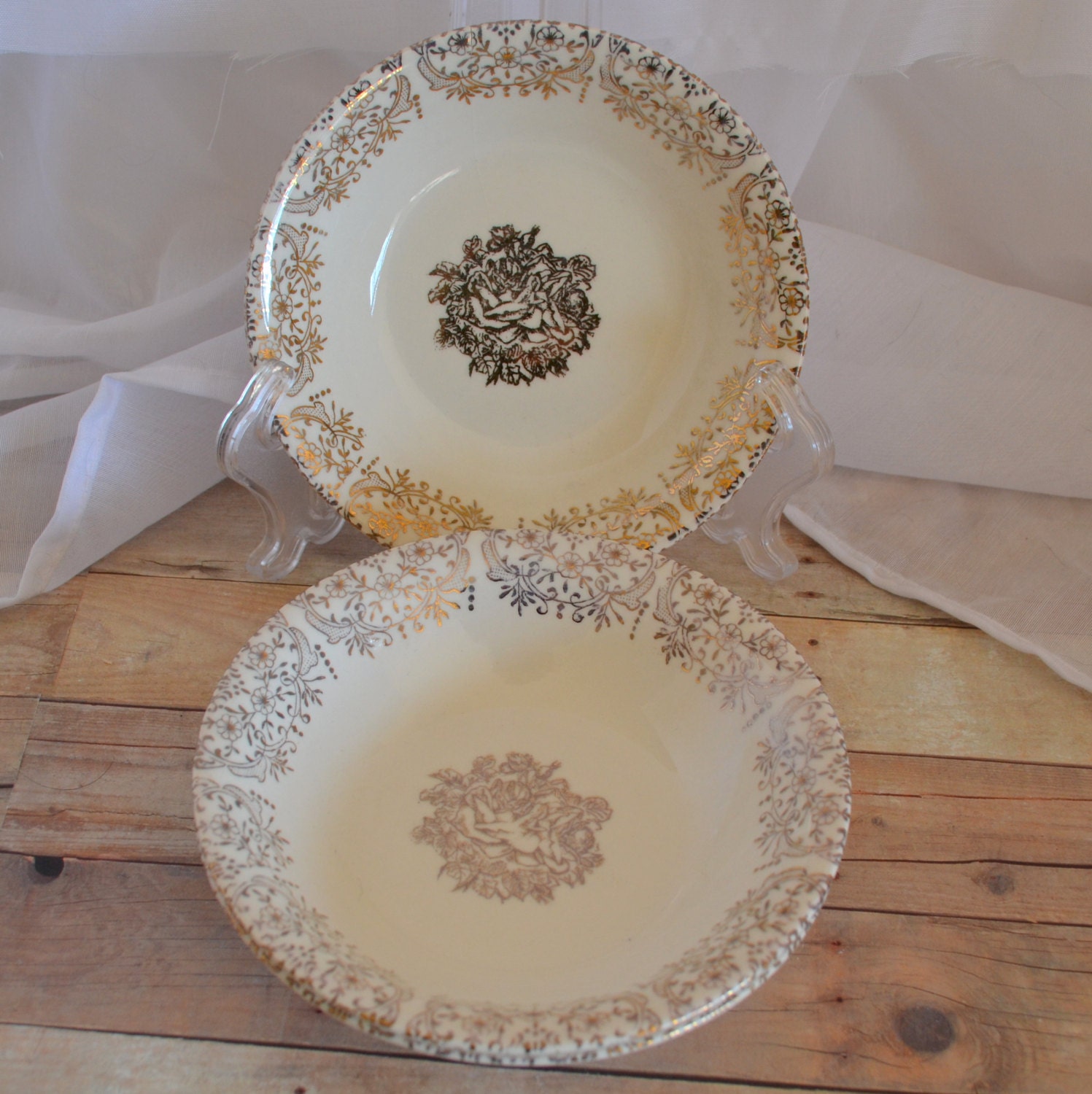 Set of three small cream colored nut dishes with gold/golden scroll