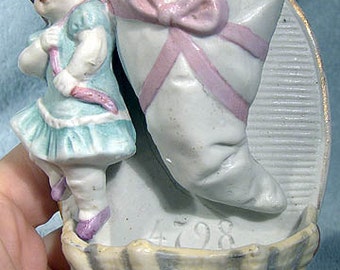 Porcelain Figural Match Striker Holder 1870 - 1890 Girl with Presents