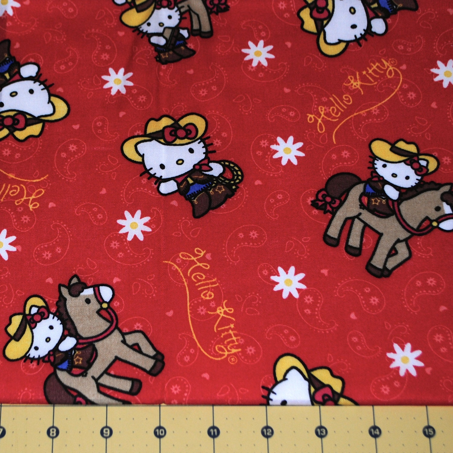 Fat Quarter Adorable Hello Kitty Cowgirl on red background
