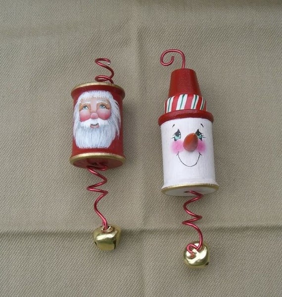 santa and snowman duo ornament on wooden thread spool santa and snowman duo ornament on wooden thread spool