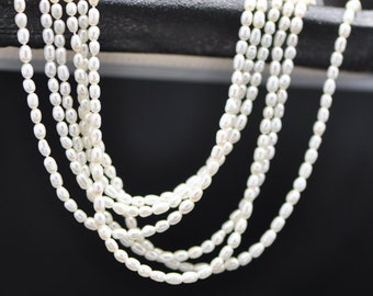 Tiny Freshwater Rice Pearl, White Oval Seed Pearl beads 2mm Thick - (PL02-1)/ 15.5" full strand
