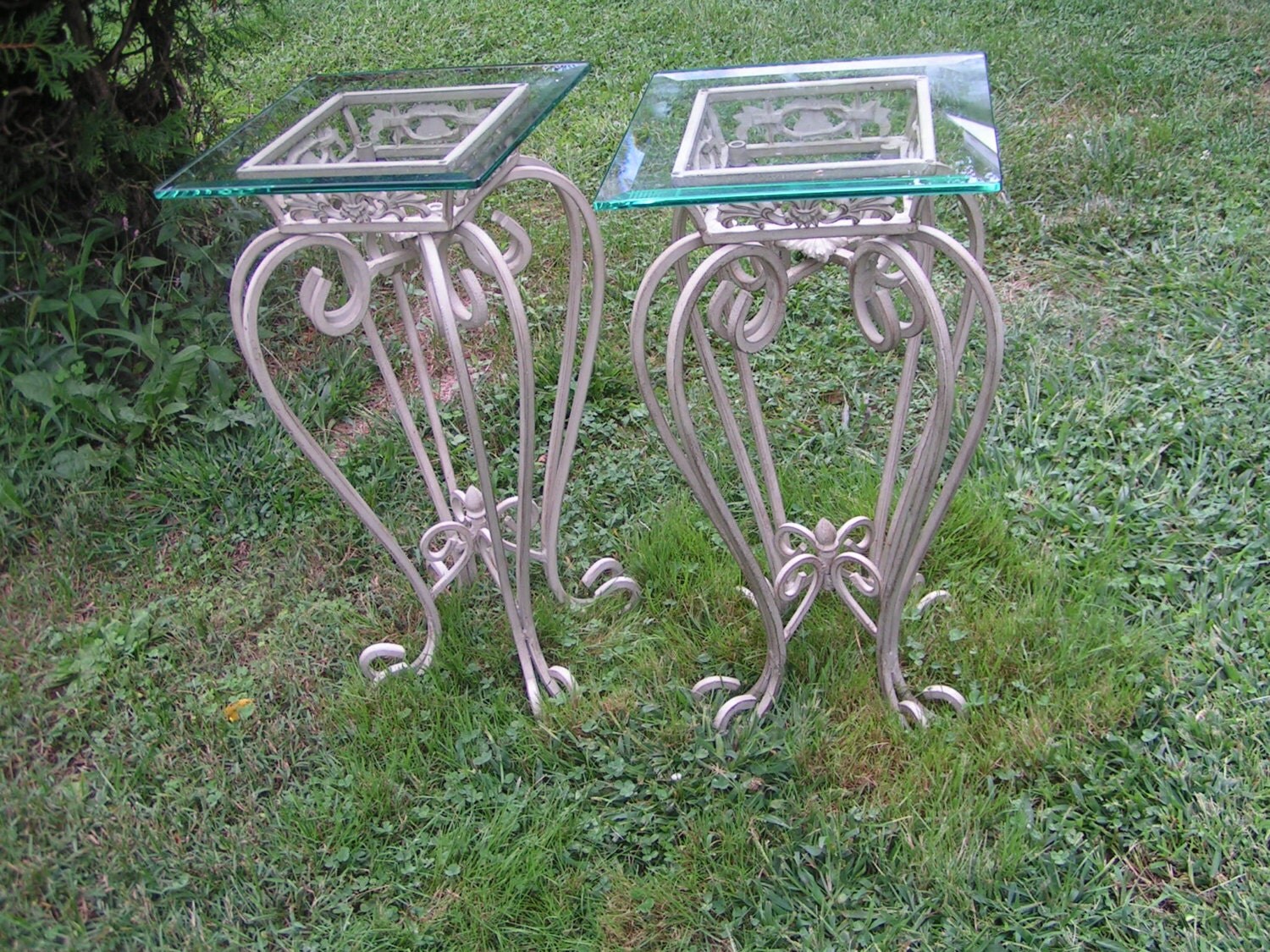 A Pair of Ornate Vintage Wrought Iron Patio Tables with green