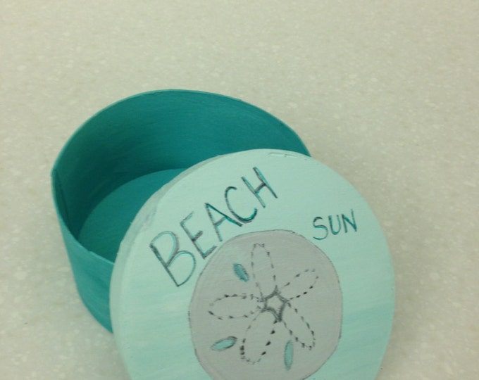 4 1/2" diameter round wood box with lid. Aqua with sand dollar and "Beach, Fun, Sun" on Top