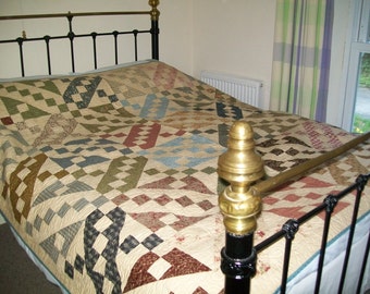 NEW patchwork quilt made from all new cotton fabrics, in lovely soft colours