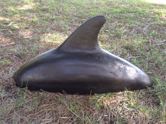 outdoor concrete dolphin statues