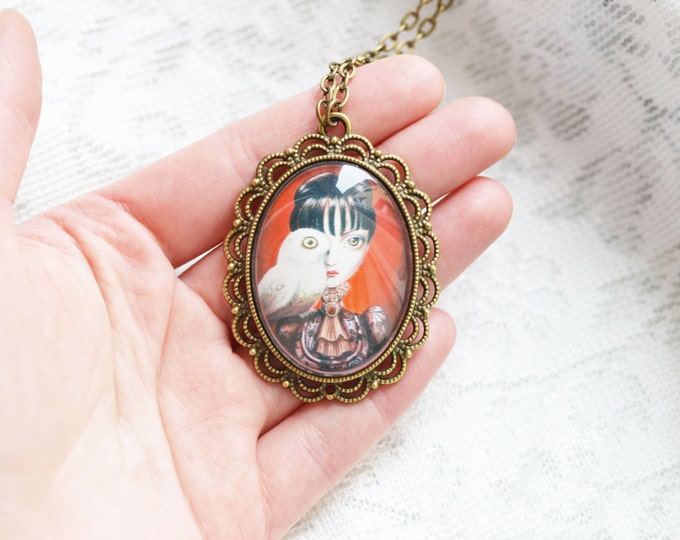 MODERN ART Oval pendant metal brass with the image of the girl with owl under glass