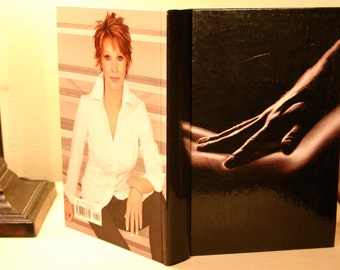 Hollow book safe with hidden storage space in a recycled book, Play Dirty by Sandra Brown, secret compartment, hidden storage, erotic book