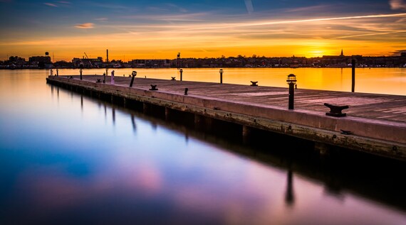 Long exposure of a pier at sunset, in Fells Point, Baltimore, Maryland 