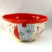 Ceramic serving bowl in red with hand carved woodland design