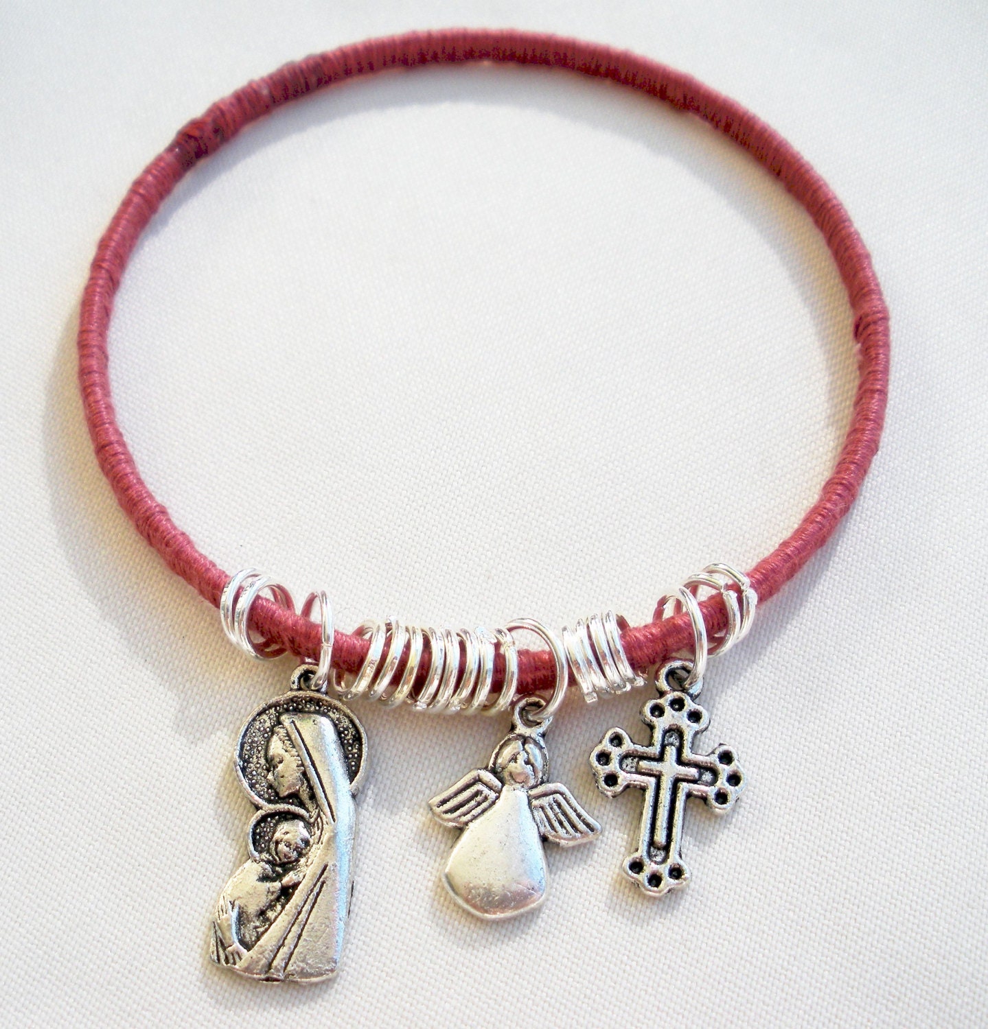 Wrapped pink thread Bangle with mary angel and by TopsailWinds