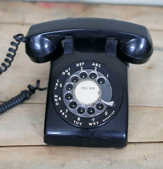 vintage black rotary phone by ITT