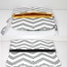 grey and white clutch bag