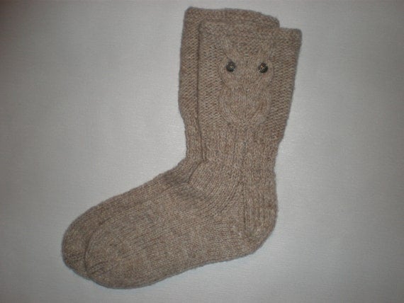 Hand-knitted oatmeal color women socks with owl pattern