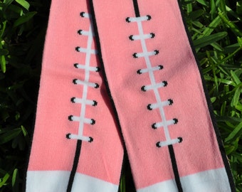 pink leg sleeves football