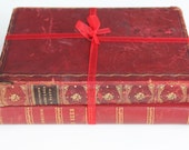 Pair of red leather bound antique books - decoration or ornament