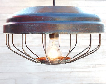 Hanging light from reclaimed chicken feeder brought back to life in dark bronze finish