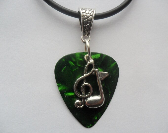 Green guitar pick necklace with treble clef music note charm that is adjustable from 18" to 20"