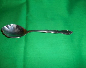 One (1), Stainless, 6" Shell Sugar Spoon, from 1847 Rogers Bros. / International Silver, in the Anniversary Pattern.