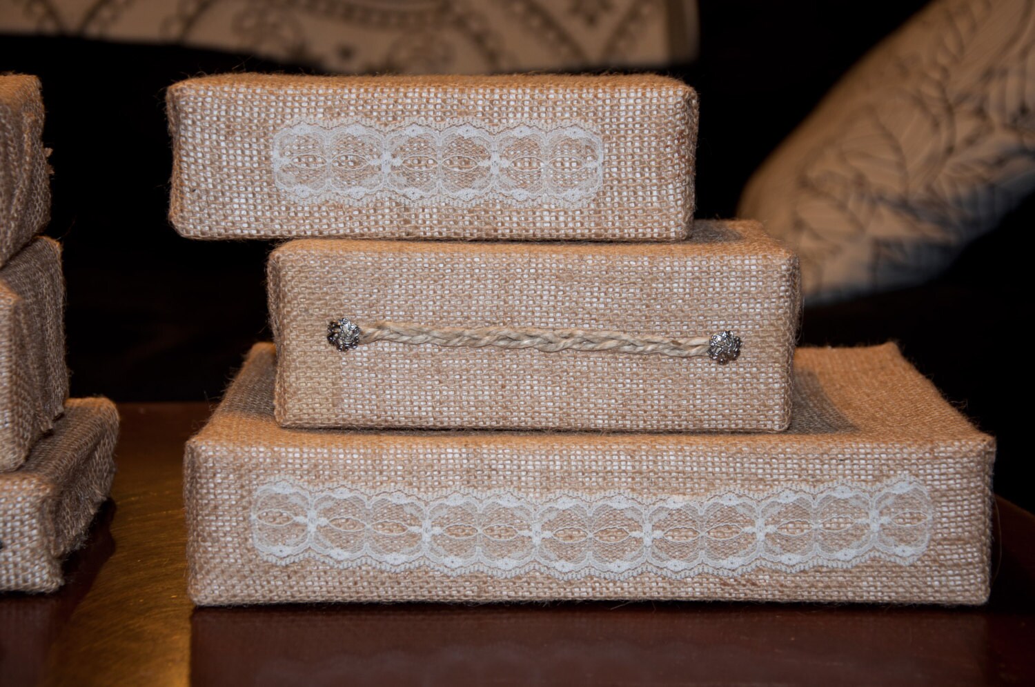 Set of Decorated Burlapwrapped boxes use as stands by asimpson98