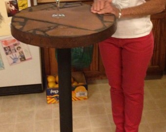 Tall Boy: Stone topped bar table 23" top diameter 43" tall.