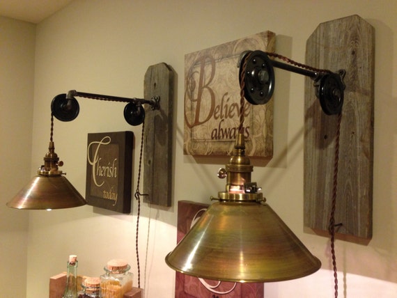 Items similar to Wall hanging industrial pendant light with pulleys and brass shade on Etsy
