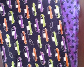 Halloween cotton reversible primitive table runner with colorful hearses, coffins, black cats on purple fabric