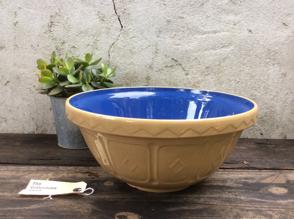 Large traditional mixing bowl with Blue internal and branded base. 12