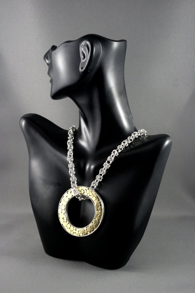 Art jewelry. Gold Olympic ring necklace. Donat necklace.