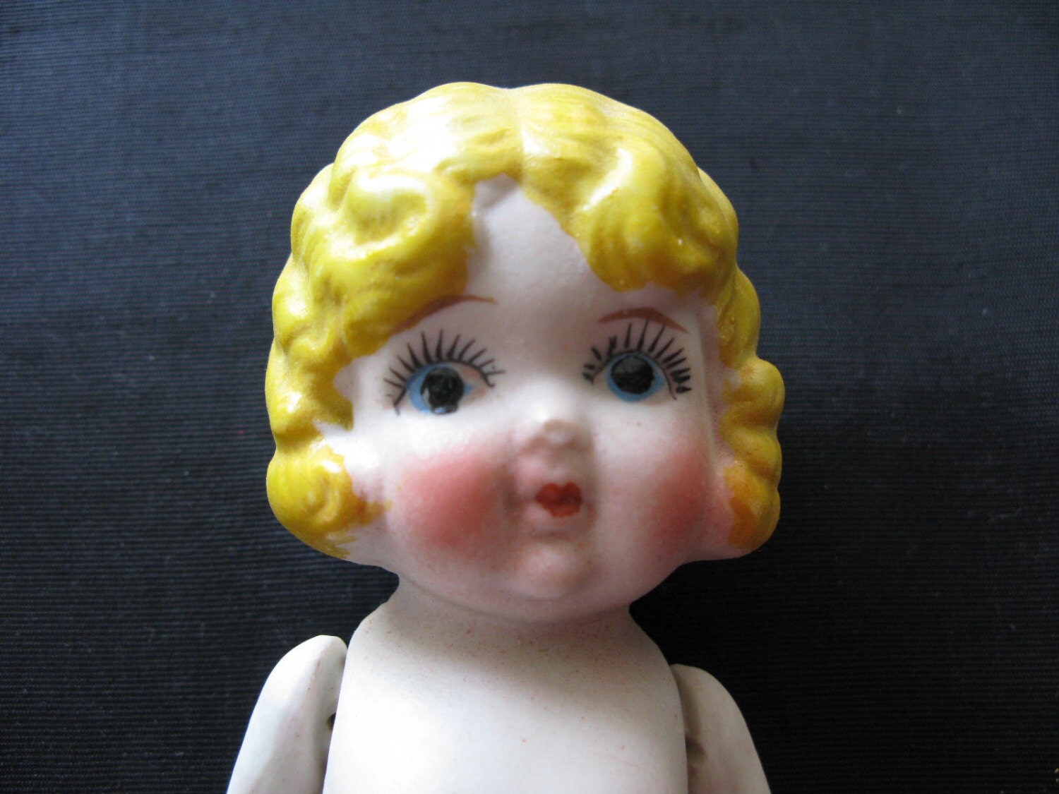 porcelain kewpie doll