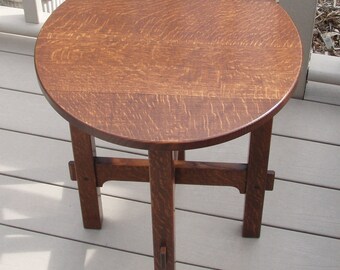 A reproduction Stickley 603 Tabouret.