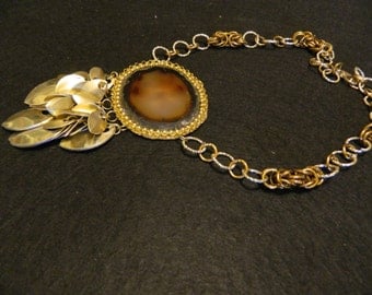 Necklace with brown agate central. Chainmaille and scales anodized aluminum