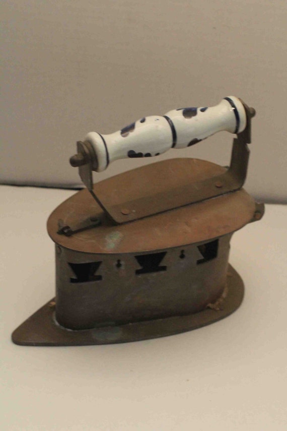 Antique Sad Brass Coal Iron With Porcelain Handle by 2BarnPickers