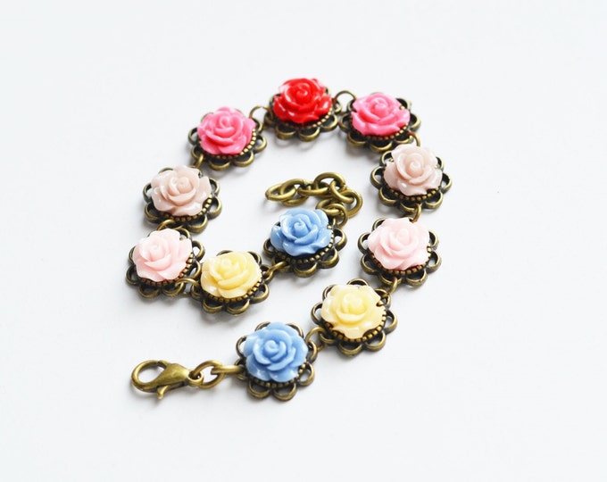 FLORAL MOTIFS The bracelet metal brass with roses of polymer clay