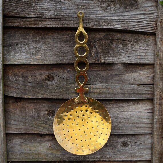 Large brass spoon with small holes vintage decorative