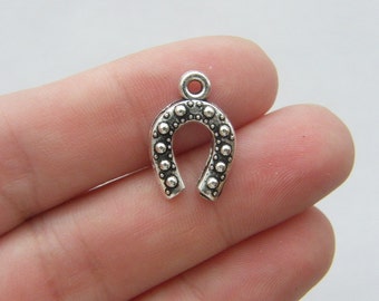 10 Horseshoe charms antique silver tone A554