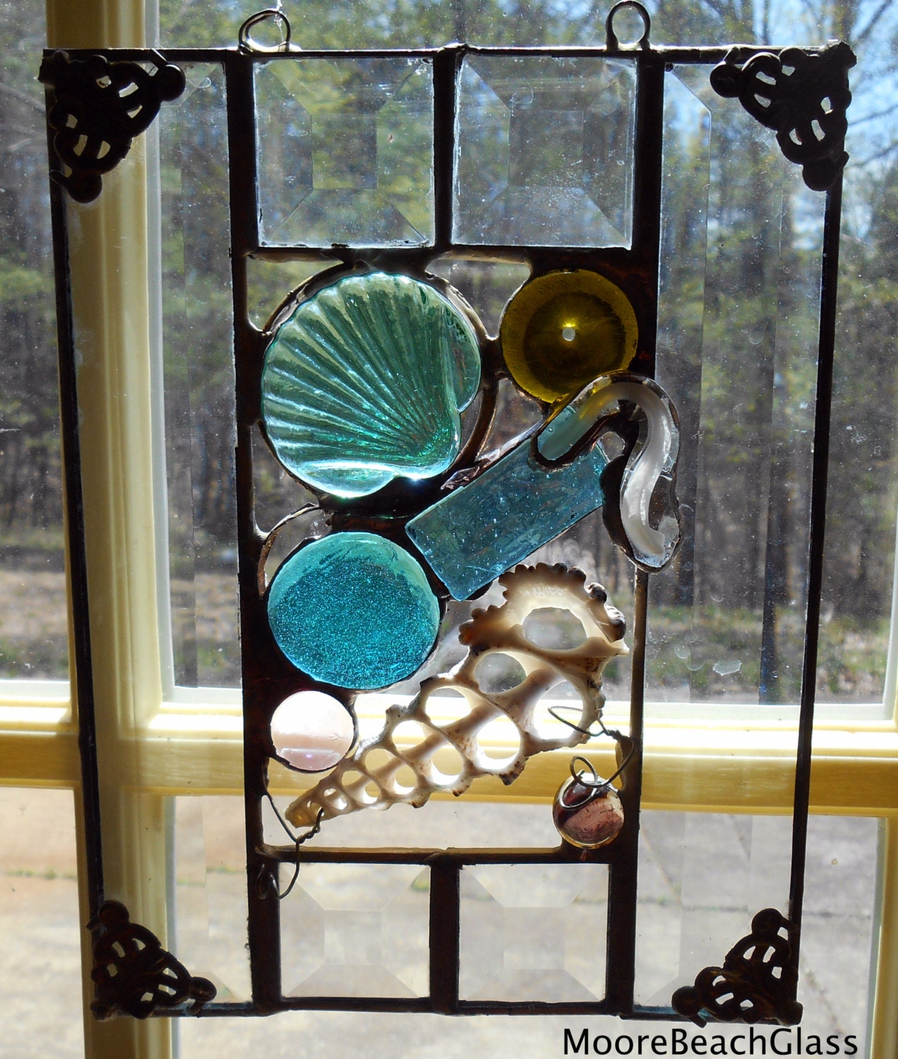 Stained glass beach theme panel with several shades of blue