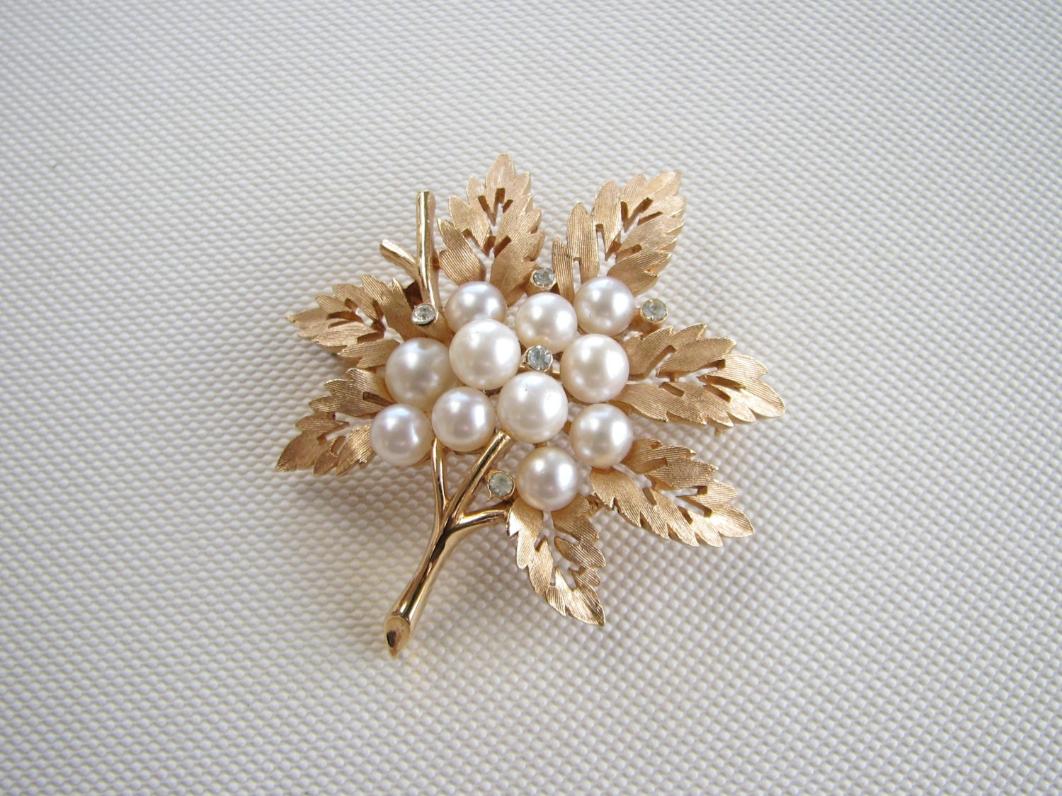 Vintage Trifari gold tone leaf brooch with faux pearls and