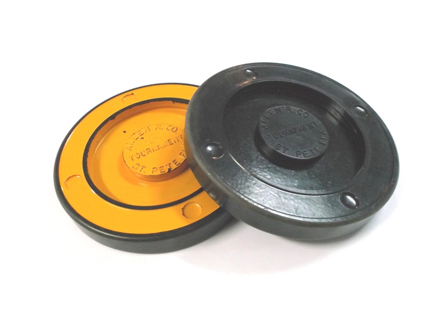 Two vintage shuffleboard pucks yellow and black Allen by