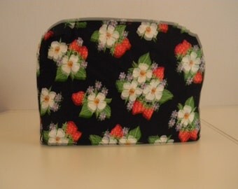 4 slice toaster cover strawberry on black background