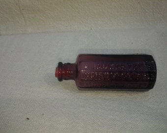 Two Amethyst Wheaton N.J. miniature bottles, A Jancasters Jaundice Bitters and Straubmullers Golden Elixer Tree of Life