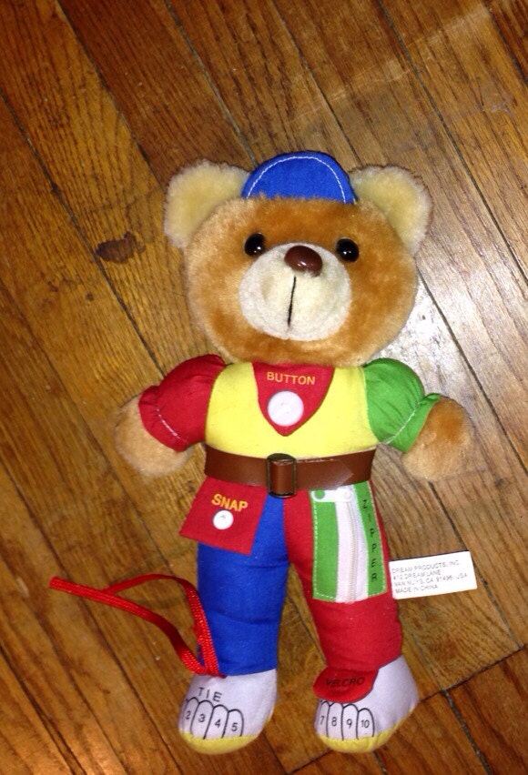 teddy bear with zippers and buttons