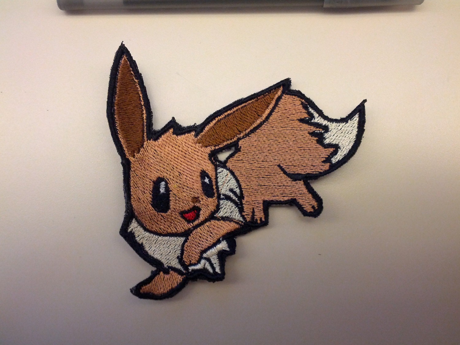 Shiny Metallic Embroidery Eevee patch. Pokemon Iron by Critstitch