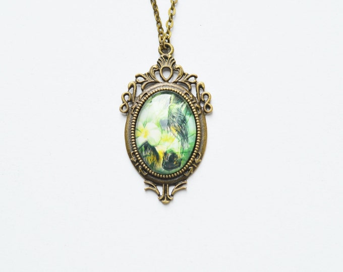 ART Oval pendant metal brass with the image of horses under glass