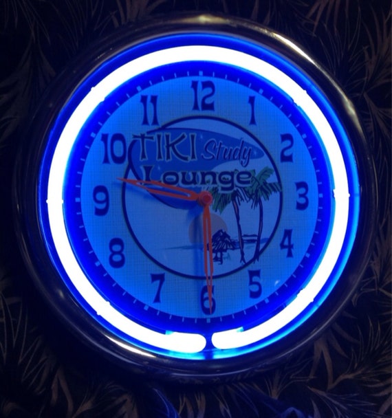 Neon Retro Tiki 11 Wall Clock The cool blue by mymidcenturyliving