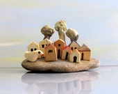 Beach art ceramics and pottery handmade sculpture , ceramic sculpture , miniature houses on a beach stone / rustic / beach / one of a kind