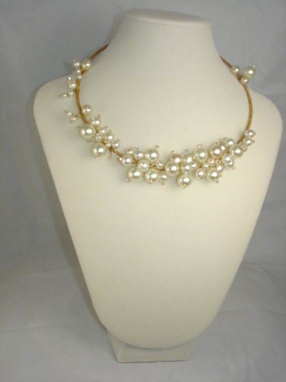 Pearl choker asymmetrical style necklace on neck wire asstd