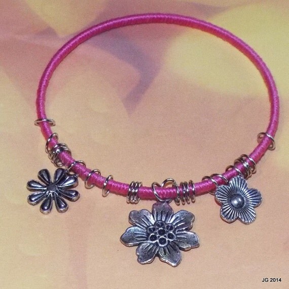 Items similar to Wrapped bangle with silver flower charms on Etsy